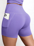 Short yoga poches taille haute, coloris violet